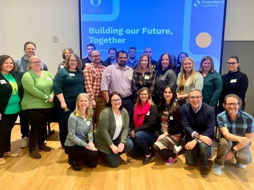 Group of professionals participating in a leadership development program focused on team alignment and organizational growth
