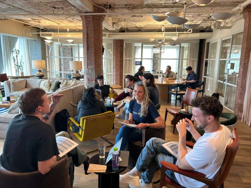 Professionals participating in a team coaching workshop focused on leadership development, reflection and collaboration